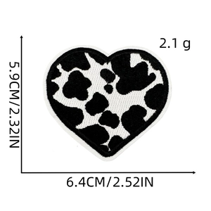 Cute cow print heart embroidery patch measuring 2.52 by 2.32 inches for DIY clothing