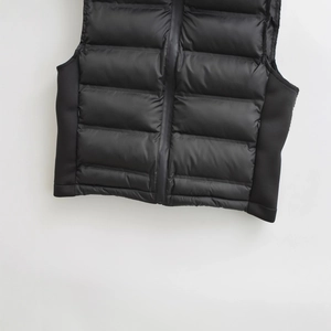 Women's black quilted puffer vest with zipper closure and horizontal stitching design