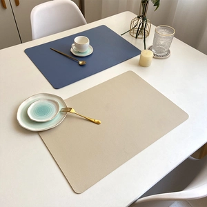 Minimalist double-layer leather placemats in blue and beige for heat-resistant dining table decor