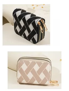 Close-up of woven textured mini card wallets with double golden zippers and plaid patterns