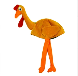 Close-up of turkey shaped plush party hat with yellow fabric and red festive details