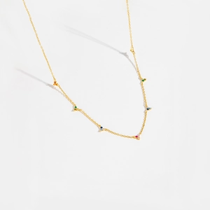Detail of a gold-plated S925 silver chain featuring vibrant multi-color gemstones