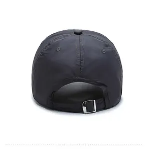 Detail view of dark grey baseball cap with quick-dry fabric and adjustable metal buckle