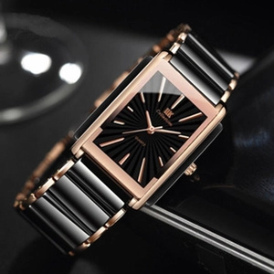 Macro shot of rectangular black sunray dial with rose gold accents and I&K branding