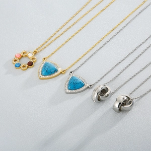 Variety of crystal stainless steel necklaces with geometric pendants in gold and silver