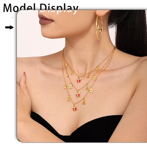 Three-layer 18K gold plated Christmas necklace and hoop earrings set on female model
