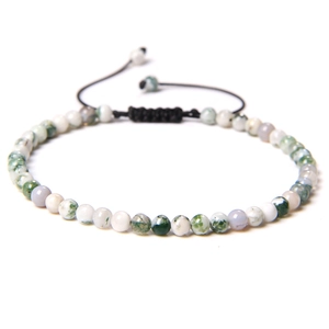 Close-up of 4mm moss agate stone bead bracelet with adjustable black braided cord