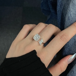 Macro shot of S925 sterling silver ring featuring a square ice flower zircon on finger