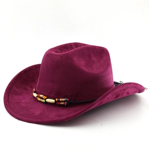 Close-up of burgundy suede western cowboy hat with ethnic beaded band and upturned brim