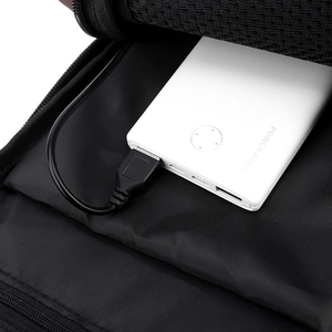 Interior detail of men's sling bag with mesh compartment and power bank storage pocket