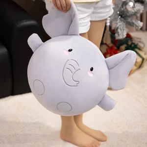 Soft round grey elephant plush toy with cute ears, held by a child in home setting
