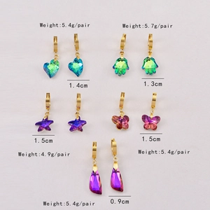Detail showing various glass charms with dimensions and weights on a light background