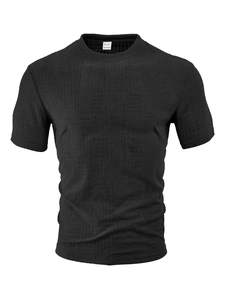 Close-up of black men's short sleeve polo shirt featuring square jacquard texture detail