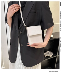 Vertical off-white crossbody phone bag with sleek flap and fine leather texture for women