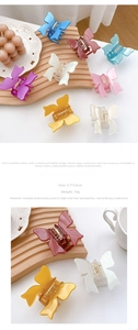 Detail of 5.7cm butterfly hair claw made of acetate material with spring closure