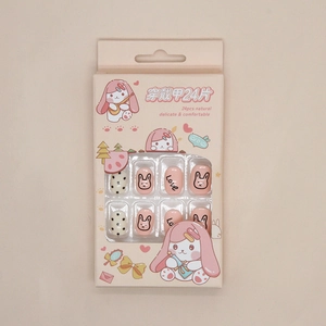 Close-up of pink cartoon bunny press-on nails set with Love patterns and black dots