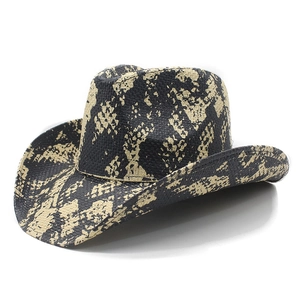Close-up of cowboy straw hat with bold black and yellow snakeskin pattern print