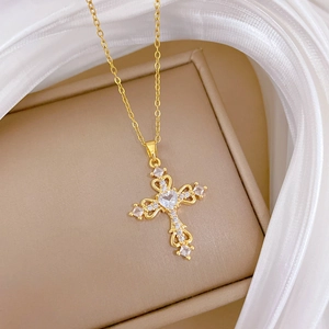 Elegant gold hollow heart cross necklace featuring sparkling crystals for women