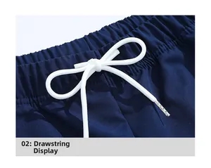 Close-up of navy blue trousers featuring elastic waistband and white braided drawstring