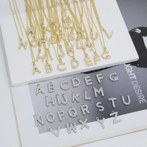 Classic 18k gold plated necklace featuring pearl-inlaid initial A-Z alphabet pendants