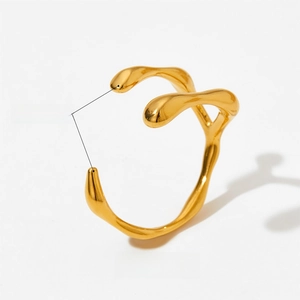 Detailed shot of irregular gold adjustable ring with polished organic wave design