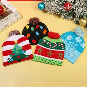 Knitted LED Christmas beanies featuring reindeer and gingerbread patterns with Pom Poms