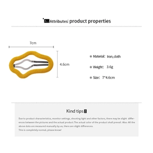 Detail view of wave-shaped yellow flocked hair clip showing size of 7cm by 4.6cm