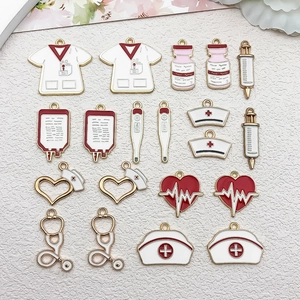 Detailed close-up of colorful medical enamel charms including nurse hats and syringes
