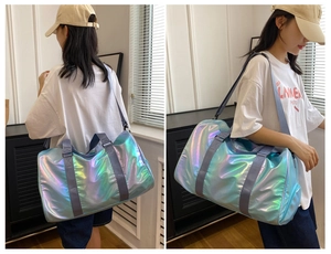 Holographic gradient travel bag with separate shoe compartment shown on a model