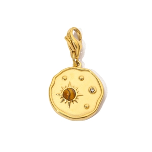 Detail of vintage sunburst pendant with tiger eye stone and lobster clasp closure
