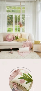 Detail of pink tulip floral embroidery and ruffled round pillow for Nordic home decor