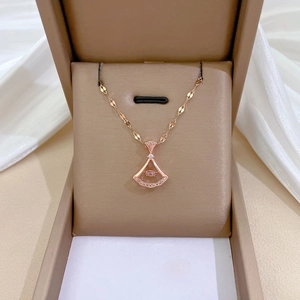 Elegant rose gold skirt pendant necklace with dancing pink stone and pave crystals