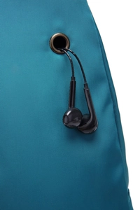 Detail of dark teal nylon crossbody bag featuring a bronze-tone metal earphone jack hole