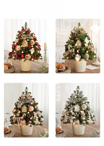Macro detail of mini desktop Christmas trees in four colors with LED lights and iron base