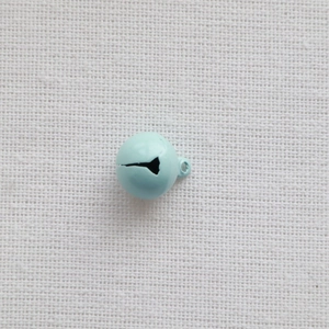 Close-up of a 14mm light blue painted metal bell for DIY crafts and pet accessories