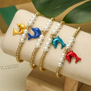 Fashion pearl dolphin charm bracelet set with colorful sea-themed pendants on display