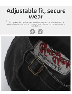 Detail of adjustable metal buckle and embroidered cotton lining on vintage washed denim cap