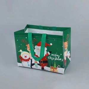 Detail of Christmas non-woven gift bag showing Santa and Snowman holiday patterns