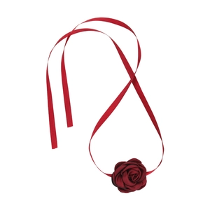 Macro shot of handcrafted burgundy satin rose pendant on a delicate ribbon choker