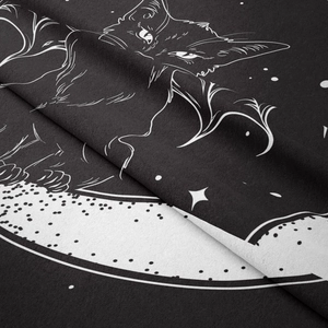Detailed view of black fabric with white cat moon and star astrology line art print
