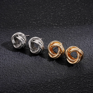 Irregular geometric interlaced knot stud earrings in polished gold and silver finishes