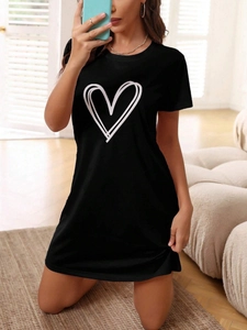 Close-up of heart print detail on a black short-sleeve cotton lounge t-shirt dress