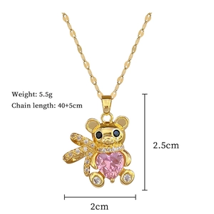 Detail view of teddy bear necklace with pink heart gem and crystal paving size specs
