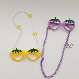 Detailed top view of strawberry shaped kids glasses frames with decorative bead chains