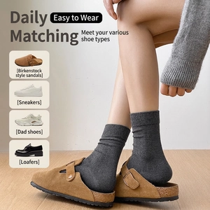 Deep grey ribbed cotton crew socks for women styled with brown suede mule shoes