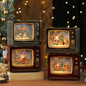 Vintage TV Christmas music box with swirling snow, Santa and reindeer scenes in bronze and red