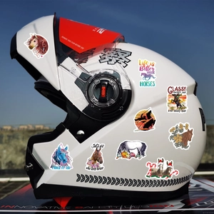 Waterproof horse stickers decorating a white helmet against a clear blue sky