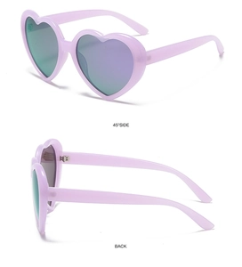 Detail view of heart-shaped sunglasses in lavender with colorful mirrored lenses