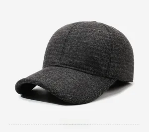 Close-up of thick grey wool fabric texture and Fashion label on winter baseball cap
