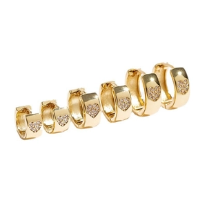 Three sizes of gold heart huggie hoop earrings with mini cubic zirconia inlays